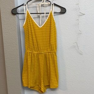 Woman’s yellow and white striped romper
